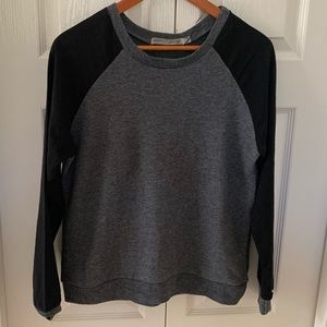 Heather Grey top with black semi-transparent arms